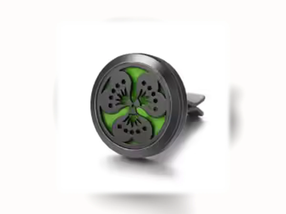 Schwarzer runder Aromatherapie-Autoclip mit Motiv Dreifachspirale