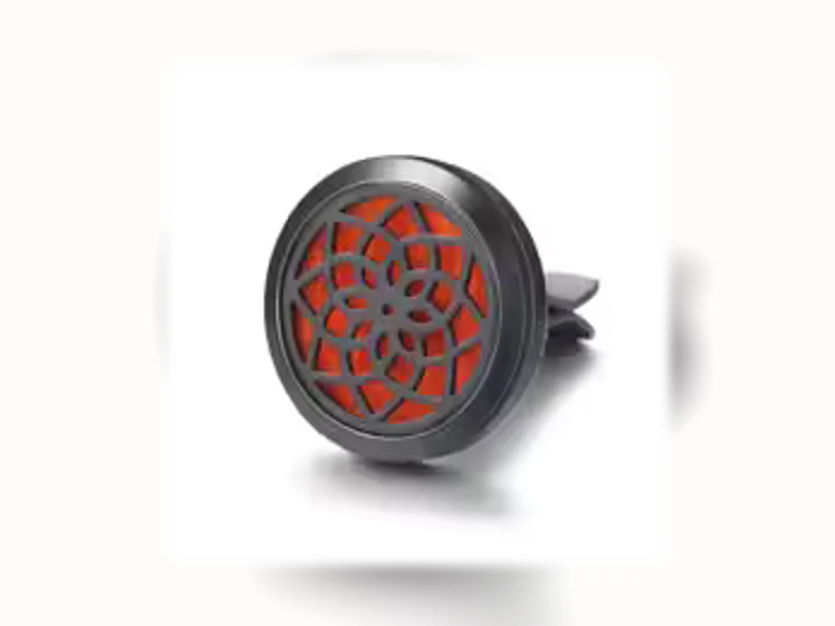 Schwarzer runder Aromatherapie-Autoclip mit Motiv Lebensblume Orange